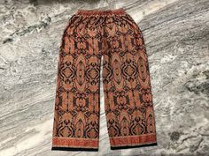 Handmade Item  Bohemian Silk Palazzo for Women ~ Floral Print Wide Leg Silk Trouser ~ Silk Pant ~ Boho Hippie Silk Yoga Trouser ~ Comfy Nightwear Pants This is handmade bohemian print silk palazzo pants trousers made with silk fabric, This pant is made for Unisex adults, It is handmade with bohemian print. It comes with comfortable elastic waist and ankle. This is made perfect for a relaxing day at home, working out and yoga. Details - Size - Free size Waist - 26 to 42" inch Hip - 30 to 46" inch Bohemian Printed Loungewear Sets, Bohemian Full-length Harem Pants For Loungewear, Bohemian Printed Pants For Loungewear, Bohemian Printed Loungewear Bottoms, Bohemian Printed Loungewear Pants, Comfy Nightwear, Yoga Details, Silk Yoga, Yoga Trousers