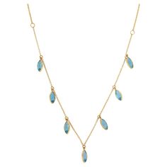 Blue Topaz Necklace in 18K Gold studded with marquise cut topaz gemstone. Accessorize your look with this elegant blue topaz chain necklace ennhancer. This stunning piece of jewelry instantly elevates a casual look or dressy outfit. Comfortable and easy to wear, it is just as exquisite worn alone or layered with other charms for a modern fashion statement. PRODUCT DETAILS :- > Material - 18K Solid Yellow Gold > Gemstone - Blue Topaz > Gemstone Weight - 2.85 ct > Gemstone pieces - 7 > Gemstone size - 8 x 4 mm > Gemstone shape - Marquise > Gross Weight - 3.324 Grams > Setting - Bezel setting > Length - 19 inches Our Gold Gemstone Necklaces are customizable according to your specifications. Go to our Storefront Page for more updates and click on the follow button to never miss out on our newl Gold Gemstone Necklace, Topaz Yellow, Blue Topaz Necklace, Topaz Necklace, American Modern, Blue Gemstones, Topaz Gemstone, Marquise Cut, Look Casual