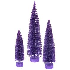 three purple christmas trees are in vases on a white background