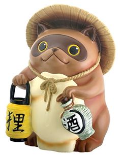 a ceramic figurine of a cat holding a bottle and a handbag with chinese characters on it