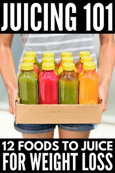 a person holding a box full of juices with the words juicing 101 on it