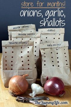 there are many different bags with onions in them and other things on the table next to it