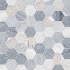 a white and grey marble tile with hexagonal design