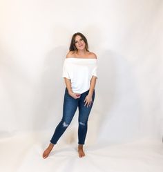 A casual top that can be worn three ways? It's true! This super soft top can be worn off the shoulder, one shoulder or on the shoulder. Featured with a beautiful drape throughout the bodice, an unfinished sleeve trim and has the softest fabrication. Also available in charcoal! Amanda has styled it with this pair of ankle skinny jeans. ivory solid knit top unfinished trim short sleeves 73% bamboo, 27% polyester One Shoulder Stretch Top For Day Out, Versatile Off-shoulder Tops For Day Out, Beautiful Drapes, Soft Tops, Solid Tops, Casual Top, Wear It, Casual Tops, Knit Top