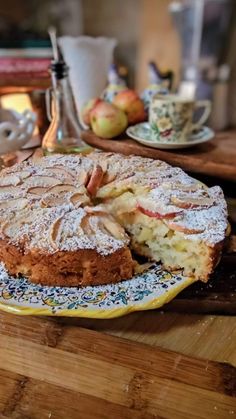 an apple cake is on a yellow plate