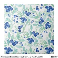 a blue and green flowered napkin on a white background