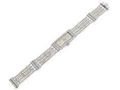 The elongated rectangular ivory dial with Roman numerals, marked "J. Jarre", within a French-cut diamond set bezel, to seven row gray and white seed pearl bracelet, with French-cut diamond spacer accents, the case engraved with Greek key and floral motifs. Movement signed M & W Ullmann. Elegant White Rectangular Diamond Watch, Elegant Rectangular Bracelet Strap Jewelry, Elegant Rectangular Diamond Watch With Bracelet Strap, Elegant White Jewelry With Rectangular Dial, Elegant Rectangular Jewelry With Diamond Hour Markers, Elegant Jewelry With Diamond Accents And Rectangular Dial, Rectangular White Gold Jewelry With Diamond Hour Markers, Elegant Rectangular Diamond Watch, Elegant Diamond Rectangular Watch