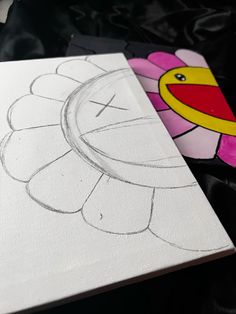 a drawing of a flower is shown on a canvas