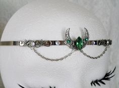 Crescent Moon Circlet This beautiful circlet has a sterling silver plated filigree crescent moon with emerald green faceted glass setting, sterling silver plated filigree accents, rhinestones and metal chain. Adjustable. Goddess Witch, Wicca Jewelry, Goddess Jewelry, New Plymouth, Wiccan Jewelry, Pagan Jewelry, Faceted Glass, Glass Set, Crescent Moon