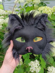 This is a high quality black cat mask. It doesn't slip off your face so it is really good for quads and goos visibility but it is a little blurry. Do not get it we or go in the rain because it is not waterproof but if you do message me. If it gets dirty, dab it lightly with a damp rag. if you have any questions about how it was made or the materials. Thank You Black Full Face Masks For Costumes, Black Full Face Masks For Costume, Full Face Black Costume Mask, Black Full Face Costume Mask, Halloween Cat Ears Mask With Whiskers, Halloween Cat Design Masks With Cat Ears, Black Cat Ears Masks For Costume Party, Black Cat Ears Mask For Costume Party, Halloween Black Cat Ears Mask