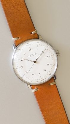 Junghans Max Bill on a Whiskey Strap from Ryokō. This watch achieves a timeless elegance that only seems to get a stronger attraction over time.. #JunghansMaxBill #MaxBill #Bauhaus Watch Minimalist, Mens Watches Minimalist, Bauhaus Watch, Junghans Watch, Minimal Watch, Minimalist Men, Wrist Game, Expensive Watches