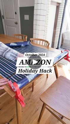 a person laying on an amazon holiday hammock in front of a dining room table