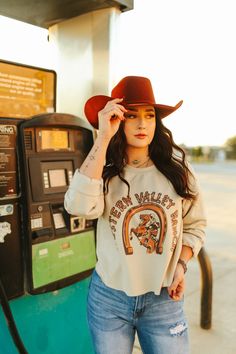 Saddle up and ride into style with our Western Valley Ranch Raw Hem Graphic Sweater! This tee features a rustic and charming design complete with a horseshoe and a cowboy on horseback. Made from soft, high-quality fabric, this tee is as comfortable as it is stylish. Made in the USA Real Turquoise Jewelry, On Horseback, Graphic Sweaters, Real Turquoise, Plus Size Shopping, Dress Romper, Long Sweaters, Hat Hairstyles, Made In The Usa