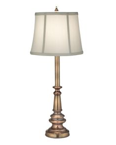 a lamp with a white shade on it