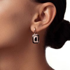 An ode to the beauty of confident femininity, the maison's Cardinal Collection is an enduring symbol of intercardinal directions of the paths we walk in life. These Geometric Black Enamel Dangle Earrings with Diamond Pavé celebrate the indisputable charm of one's inner compass through artful blackened enamelling contrasted with brilliant diamonds. Accent diamonds: 0.20+ ctw, VS2+/F+ Earrings length: each 28 mm approx. Backing: Lever backs Rose Gold Polished Drop Earrings, 14k Gold Jewelry With Black Enamel, Elegant Enamel Jewelry With Tarnish Resistance, Elegant Enamel Tarnish Resistant Jewelry, Modern Enamel Jewelry With Pierced Details, Modern Enamel Drop Earrings, Types Of Diamonds, Recycled Gold, Rose Gold Diamonds