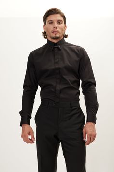 Our hidden placket shirt is tailored from pure cotton-sateen, so it's crisp and breathable. It has an immaculately tailored cutaway collar that accommodates wider ties and fastens with a silver tone tie-bar. The deep black works well with dark suiting. Made with European pure cotton premium 50s single-ply sateen fabric. It is silky and refined. This high thread count makes a shirt that looks great with denim casually, or a clean suited look. Fitted construction 100% Cotton Sateen Made in Turkey Classic Fitted Black Shirt, Black Slim Fit Shirt With Spread Collar, Formal Black Top With Spread Collar, Black Formal Top With Spread Collar, Black Fitted Button-up Dress Shirt, Fitted Black Button-up Dress Shirt, Black Fitted Shirt For Semi-formal Occasions, Fitted Black Business Shirt, Formal Black Slim Fit Shirt