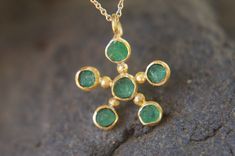 "solid 24k gold pendant//gold emerald necklace//emerald charm pendant//solid gold pendant//24k gold pendant//emerald charm//24k gold necklace 24k gold emerald pendant size of pendant 3/4\" (18 mm ) approximately , (without the bail) emerald is a 3.5-4 mm rough AAA stone. can come with a 14k chain 16- 18\" (like in the image)with additional 100 us $ This is a hand made one of a kind piece. I just got this new batch of the nicest color emerald got to give. I love this stone . Yoav" Handmade 22k Gold Green Jewelry, Gold Plated Emerald Pendant Necklace As Gift, Handmade Green Jewelry In 22k Gold, Handmade Green 22k Gold Jewelry, Gold Emerald Pendant Necklace Hallmarked, Gold Emerald Pendant Necklace With Hallmark, 22k Gold Charms Jewelry Gift, Emerald Amulet Pendant Jewelry, Emerald Pendant Necklace As Gift