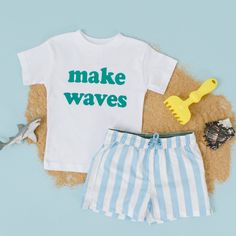 Makes Waves!  Teal Design This design is not customizable. If you are interested in purchasing  a custom order with customized text please send up a message to inquire about a custom order. Toddler and youth sizes are True to Size Toddler Shirt Features Weight:3.8 Oz Sizes:2T, 3T, 4T, 5T Tear away label Side-seamed 40 singles 50% Cotton 50% Polyester Blend  Wash: For best results wash inside out on cold and line dry. DO NOT IRON directly on the image All items are made to order in the order in which they are received so please allow 5 business days for your order to be shipped out.  Business days include: Monday - Friday Business days no not include: Weekends or Holidays. Toddler Road Trip, Teal Design, Halloween Adventure, Boy Fits, Summer Graphic Tee, Make Waves, Beach Kids, Short Styles, Summer Tee