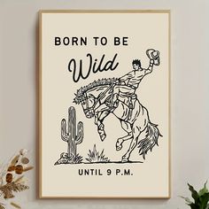 a poster with the words born to be wild on it and a cowboy riding a horse