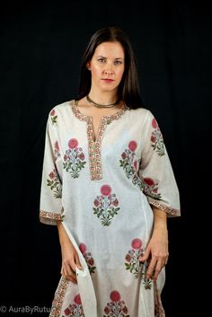 This longline tunic is hand block printed by local Indian artisans using all Azo free colors.Style tips:With an eye-catching print and a sweeping silhouette, this tunic is sure to make a statement at any leisure event. Dimension and Care:Hand wash separately in cold waterDo not Wring Line dry, steam iron onlyColors may bleed while washing*Actual color may slightly vary due to photographic lighting sources and device screen settings.* See size chart White Printed Tunic Blouse, Spring White Blouse With Block Print, White Floral Print Tunic Blouse, Traditional Floral Print Straight Kurta Tunic, Spring Printed Tunic Kurta, Printed Spring Tunic Kurta, White Printed Tunic Top, Bohemian White Blouse With Printed Motifs, Traditional White Tops With Block Print