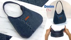 the denim purse is being held up to show how it's folded and sewn