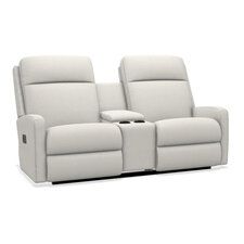 the reclining loveseat with two seats and cup holders is shown in white leather