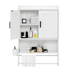 a white bathroom cabinet with lots of items on it