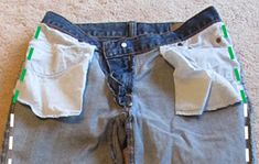 an old pair of jeans with some tape on them