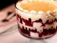 a close up of a dessert in a glass on a table