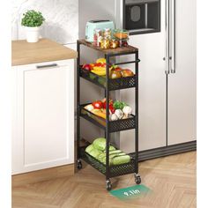 a kitchen cart filled with food next to a microwave and counter top oven on a wooden floor