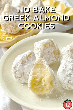 no bake greek almond cookies on a white plate with lemons in the background