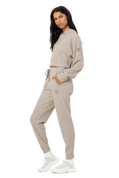 Stay seriously comfy from studio to street to lounge. The Muse Hoodie is made with a soft ribbed knit and has a relaxed, cropped silhouette and slits at sides. Pair it with the matching sweatpant to master off-duty. On-trend cropped silhouette Designed to work from studio to street Wear-tested by our in-house team for the perfect fit Muse Hoodie in Gravel Heather, Size: Large | Alo Yoga® Lounge Top, The Muse, Shopper Tote, One Shoulder Tops, Alo Yoga, Silhouette Design, Off Duty, Waffle Knit, Muse