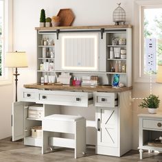 a white desk with a mirror and some drawers