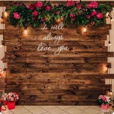 a wooden sign with flowers and lights on it that says i love you always have you