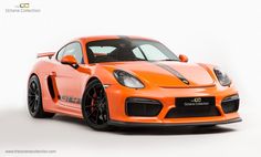 an orange sports car on a white background