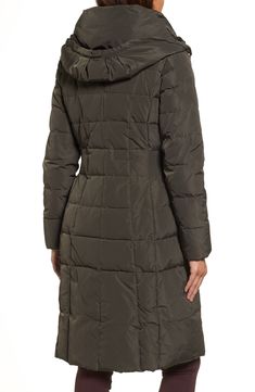 A bib insert topped with a stand collar adds another layer of cozy warmth to a box-quilted coat insulated with down-and-feather fill and topped with a lofty hood. Ruched side panels nip in the waist to add flattering definition to the silhouette. 40" regular length (size Medium) Storm placket with zip/snap closure; inner zip closure Inner stand collar Attached drawcord hood Long sleeves On-seam front pockets Lined, with 50% down, 50% feather fill 100% Winter Fitted Quilted Jacket With Padded Collar, Fitted Winter Quilted Jacket With Padded Collar, Fitted Quilted Jacket With Padded Collar For Winter, Fitted Quilted Outerwear For Cold Weather, Down Feather, Quilted Coat, A Stand, Nordstrom Store, Cole Haan