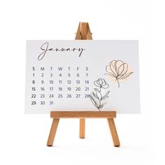 an easel with a calendar on it