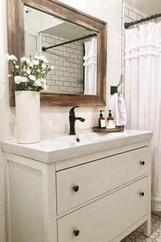 a bathroom with a sink, mirror and bathtub next to a tiled floored shower