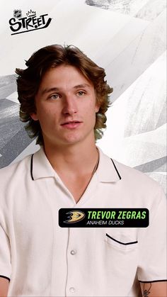 a young man wearing a white polo shirt with the word trevoir zebras on it