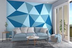 a living room with blue and white geometric wallpaper