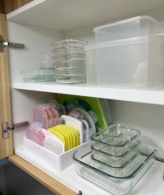 an organized kitchen drawer with dishes and containers