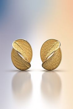 Gold stud earrings with leaf design. Flora collection. The earrings of the Flora collection have the shape of the ash leaf, a sacred tree in many cultures, a symbol of the sun and always used as a protection. The earrings feature wide and comfortable push back butterflies Ideal earrings for everyday elegance, a new talisman that will bring you luck and a good mood. The approximate weight is 3.5 grams per earring, for a total of about 7 grams. 14k or 18k gold 22 mm height 15 mm large designed and crafted in Italy ❥ Production time for custom design A new customized solid gold piece will take from 3 to 4 weeks to be designed and finished.  In case of a particular gemstone request, the time of production will result a little bit longer. If you have any special requests or questions, please do Ash Leaf, Sacred Tree, Oval Stud Earrings, Metal Clay Jewelry, 18k Gold Earrings, Everyday Elegance, Gold Leaves, Oval Earring, Gold Stud Earrings