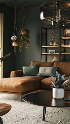 a living room filled with furniture and plants