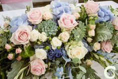 a bunch of flowers that are sitting on a table