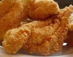 some fried food is on a white plate