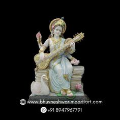 a statue of a woman playing the sita with a bird on her lap and holding a mandolin