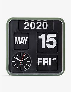 a black and white clock with the date on it