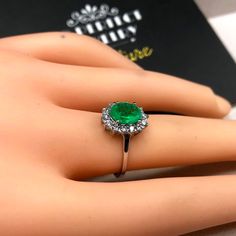 "ENJOY OUR WORRY-FREE SERVICE AND THE DAZZLING, GENUINE JEWELRY WE DESIGN AND HANDCRAFT WITH LOVE❤️ ABOUT THE ITEM: This ring is the perfect combination of elegance, simplicity, and INVESTMENT VALUE! With a CLEAN 1.18 carats, VIVID COLOMBIAN GREEN emerald, and 14 extremely sparkling diamonds. The ring was deliberately designed and handcrafted by our boutique's in-house goldsmiths. You will love this gorgeous piece as much we do. And people will absolute adore it once they see the sparkle and the Luxury Polished Emerald Ring, Luxury Green Emerald Hallmarked Ring, Colombian Emerald Ring Rozental Jewelry, Colombian Emerald Necklace, Colombian Emerald Ring, Gold Ring Engagement, Vs Diamond, Free Service, White Gold Engagement Rings