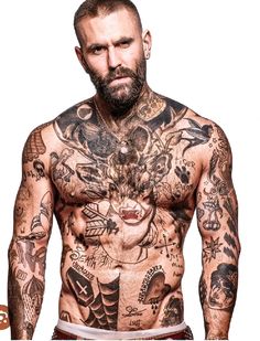 a man with lots of tattoos on his body and chest is looking at the camera