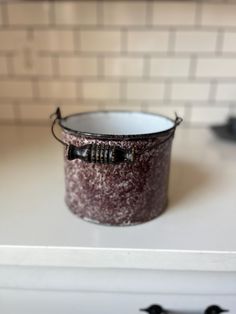 a can sitting on top of a stove